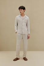 Man in off-white pajamas