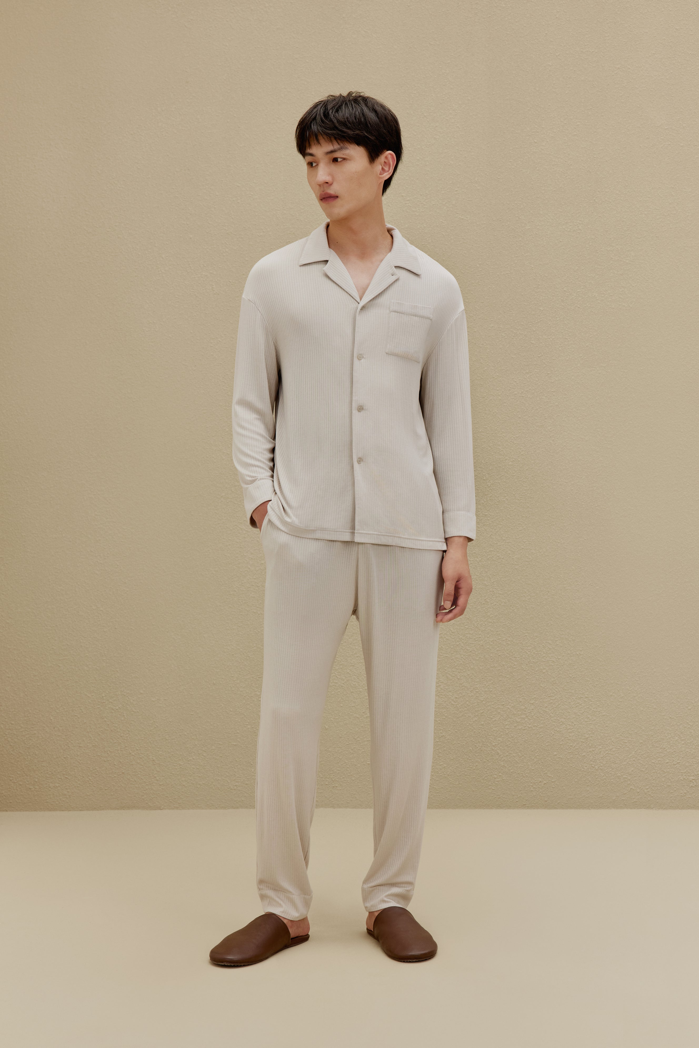Man in off-white pajamas