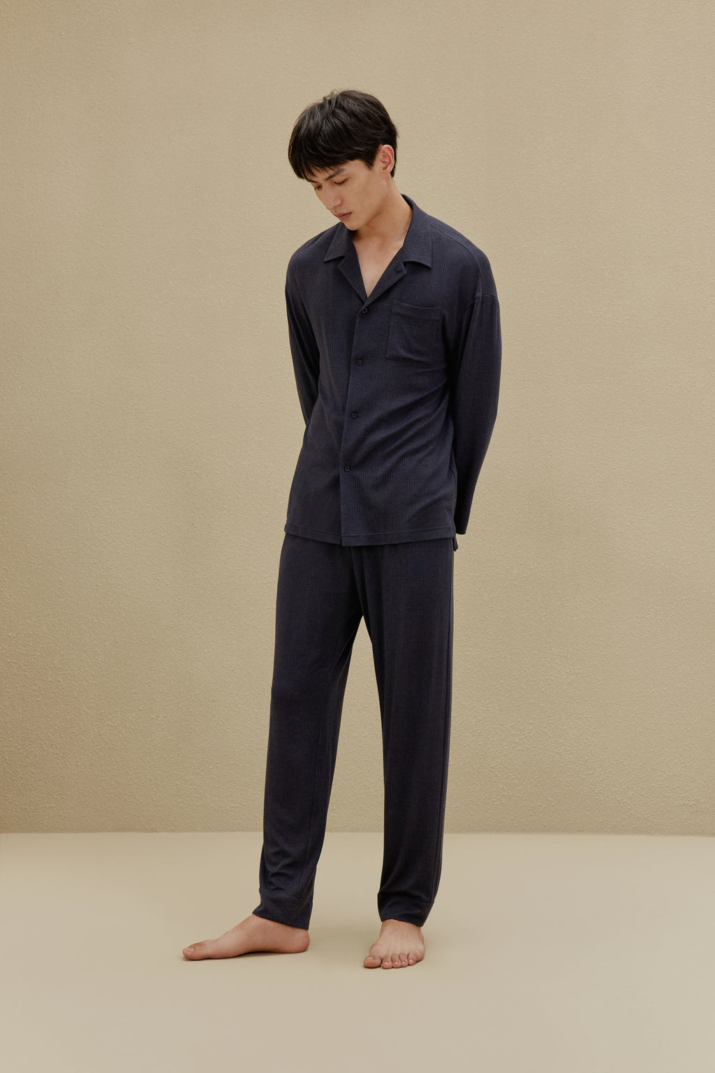 Back view of man in black pajamas