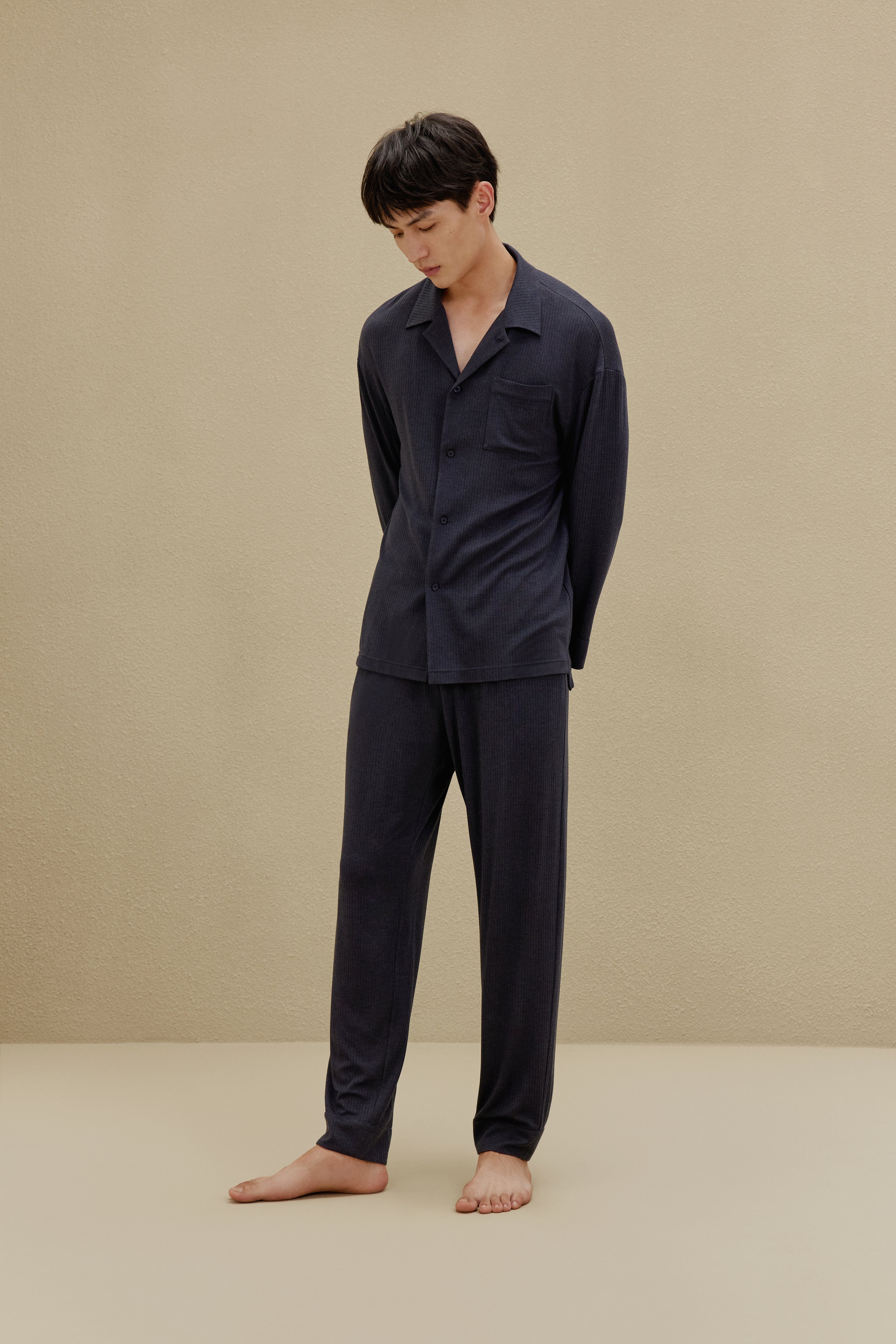 Back view of man in black pajamas
