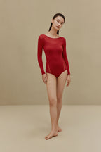 woman in red bodysuit