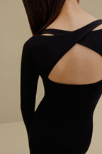 close up of back of woman in black long sleeve top