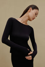 woman in black long sleeve top 