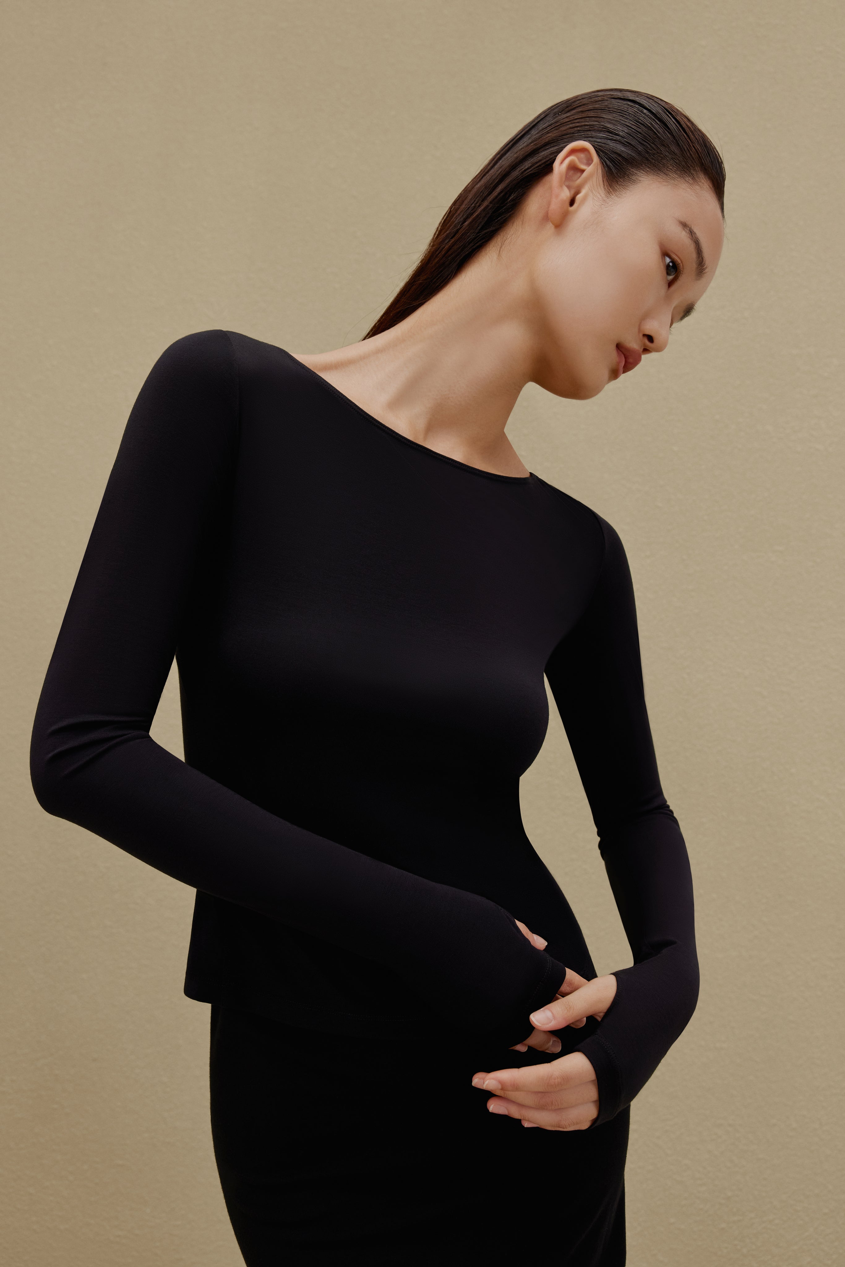 woman in black long sleeve top 