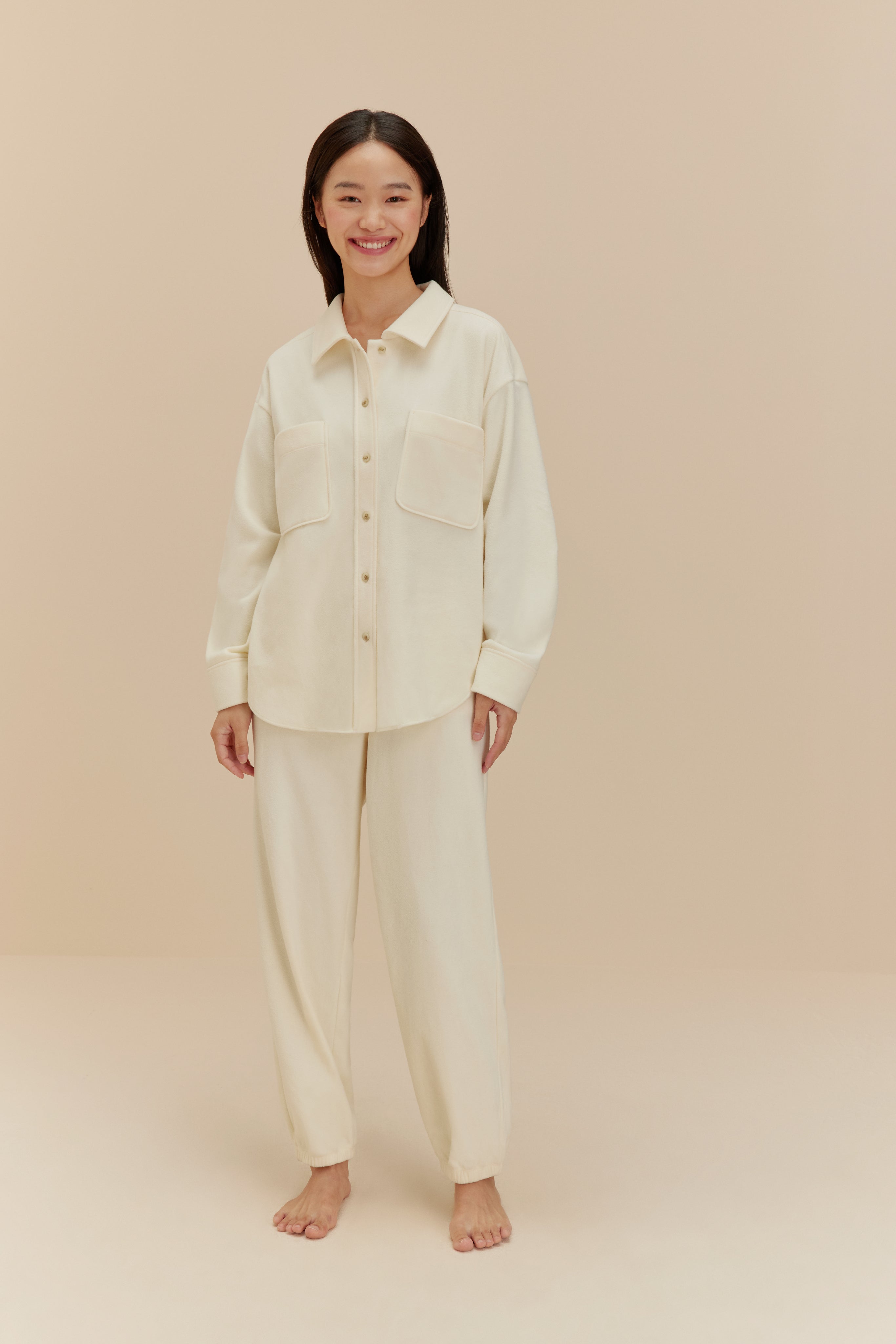 Woman wearing white Plushy Pajamas