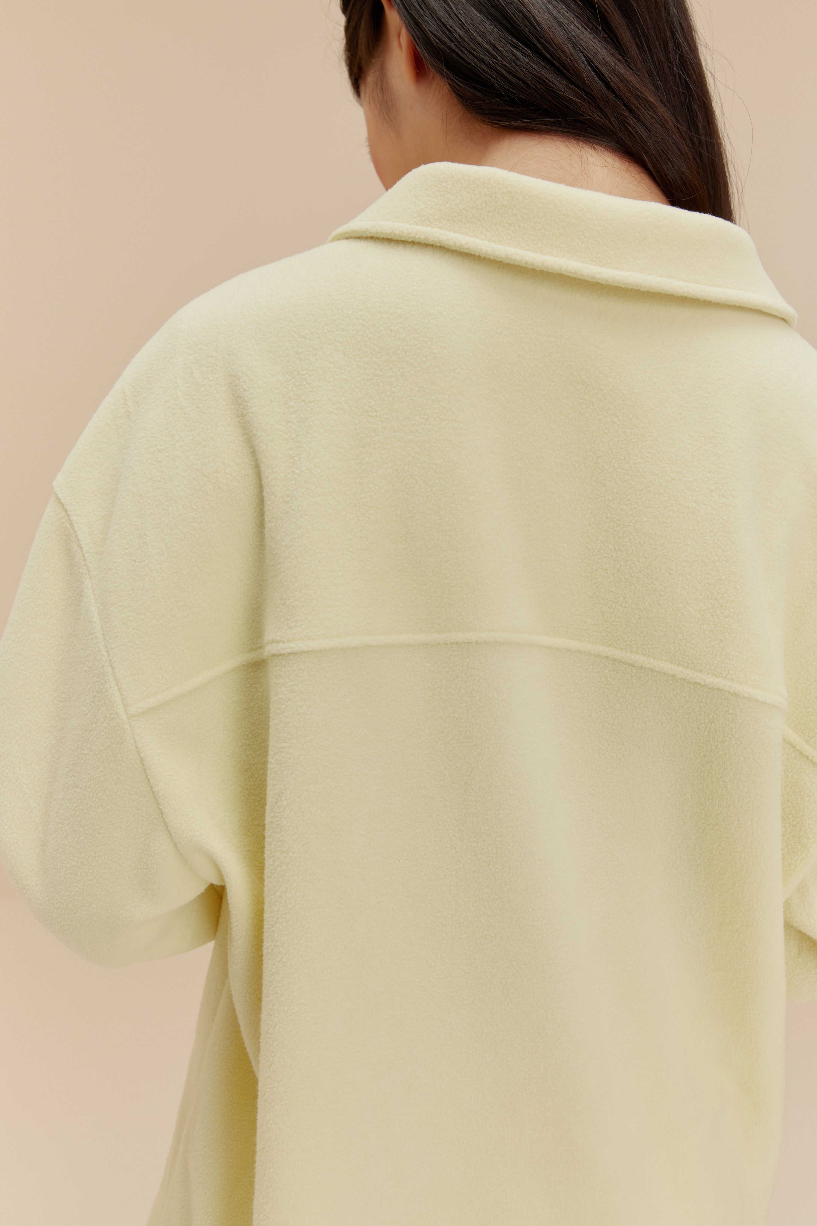 Back of woman wearing yellow Plushy Pajama Tops