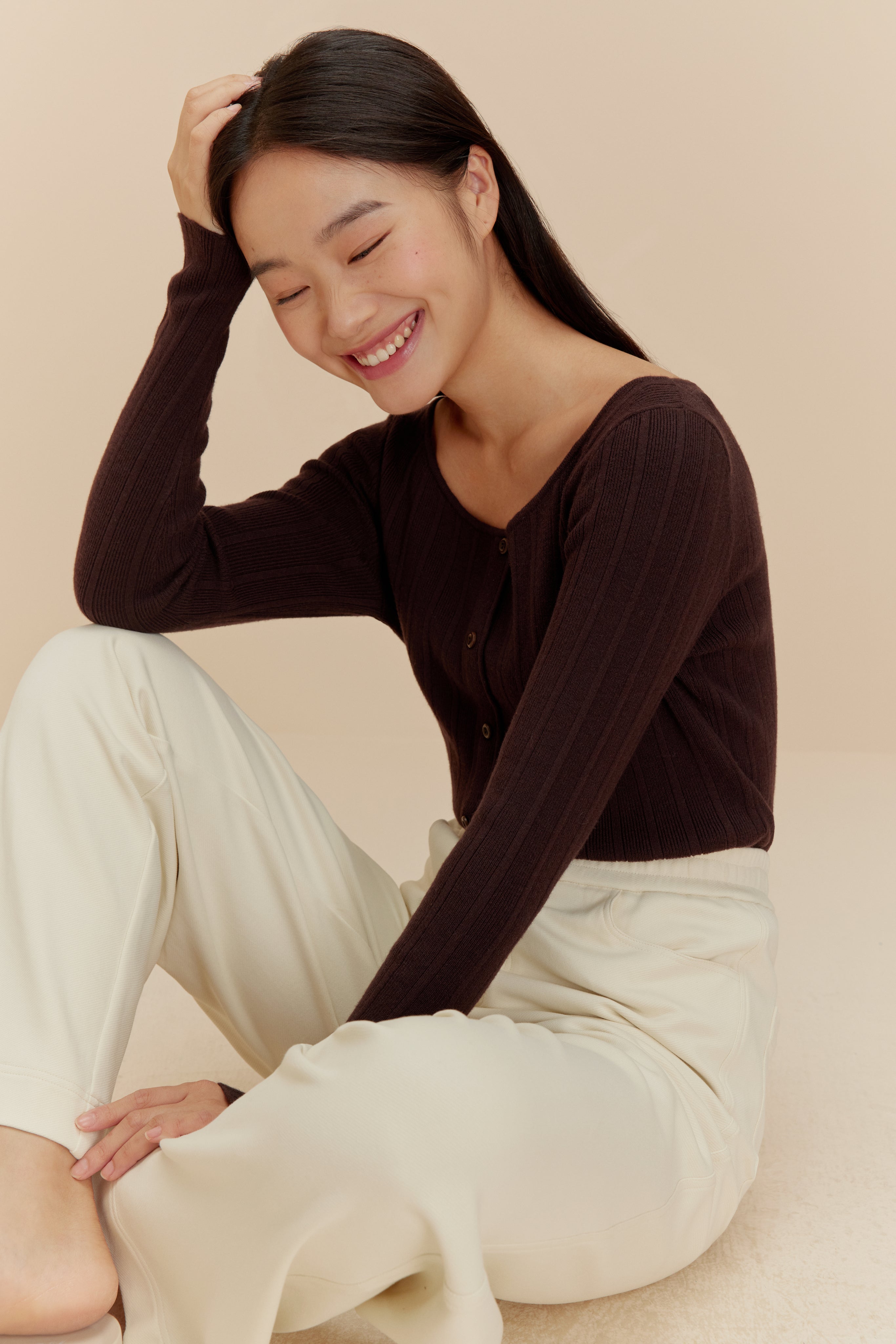 woman in brown cardigan