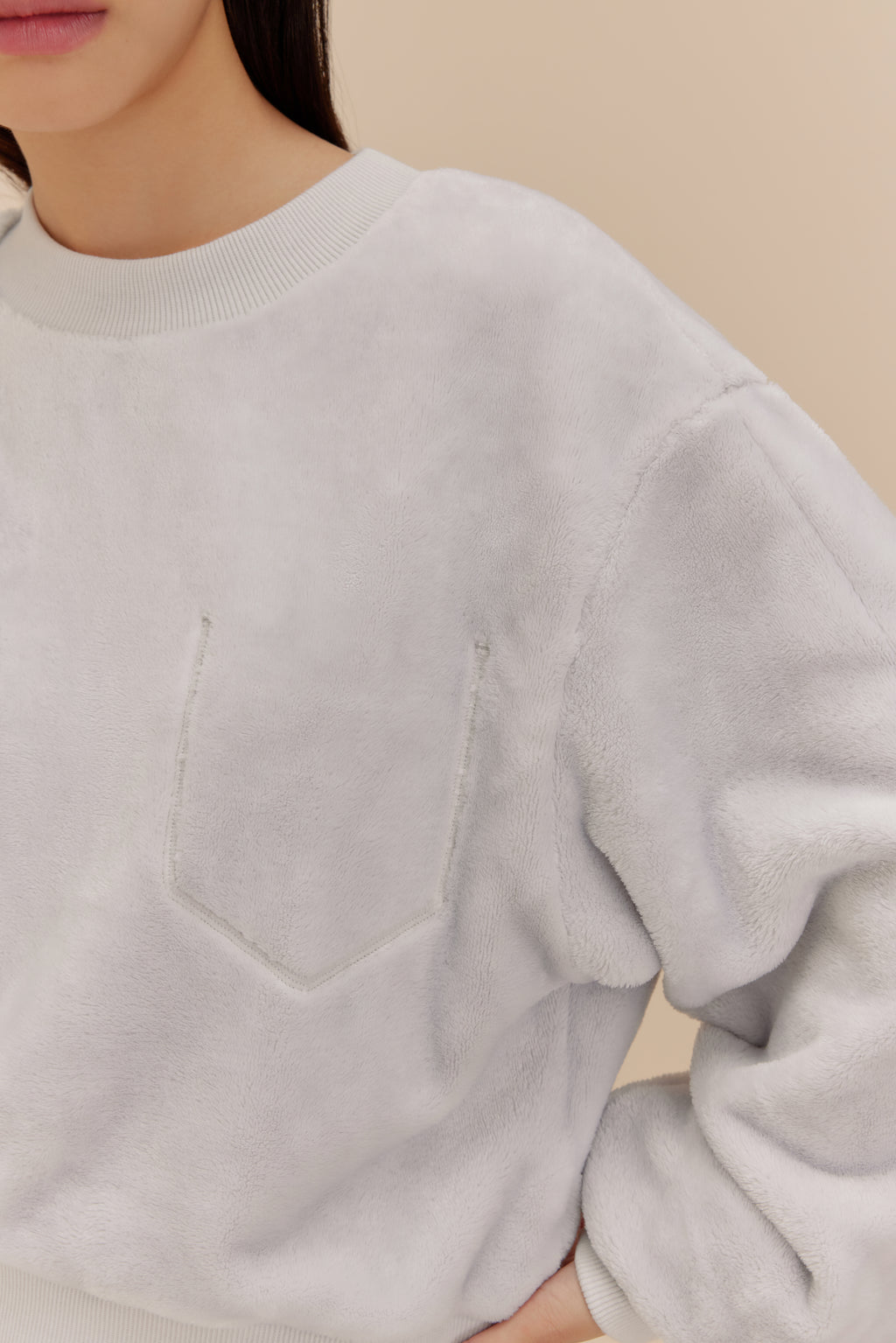 woman wearing light blue fleece top
