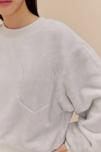 woman wearing light blue fleece top