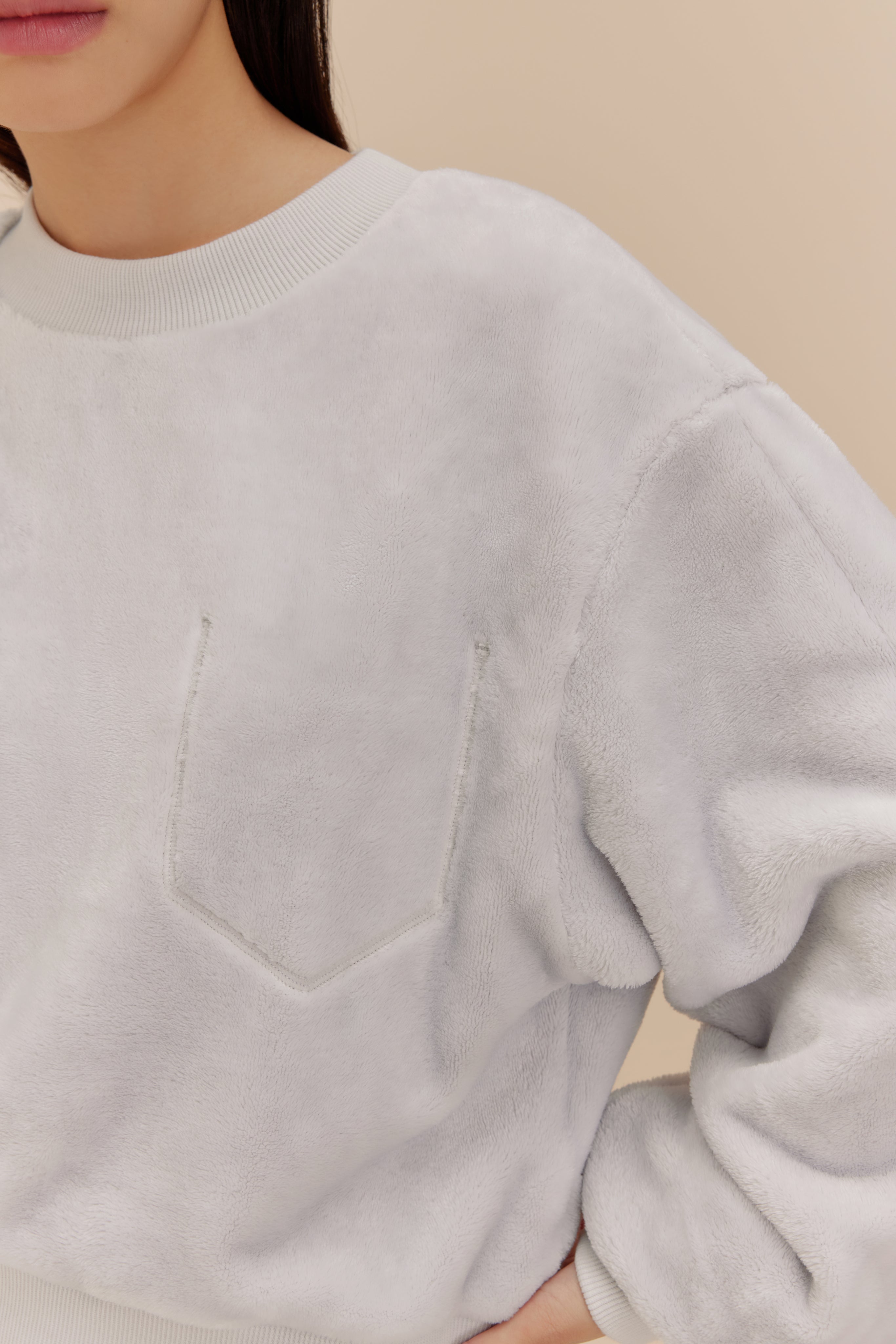 woman wearing light blue fleece top