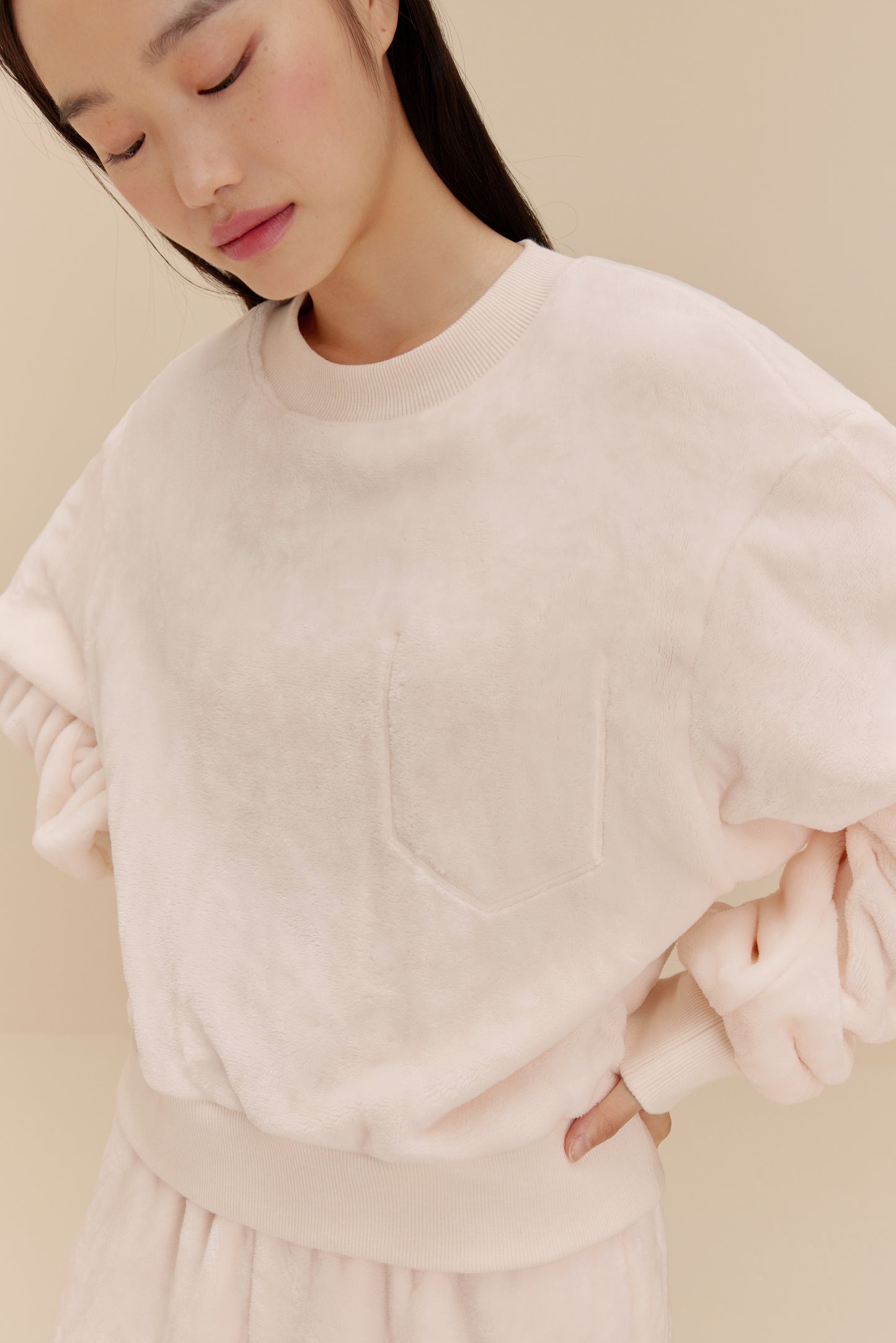 woman wearing white fleece top