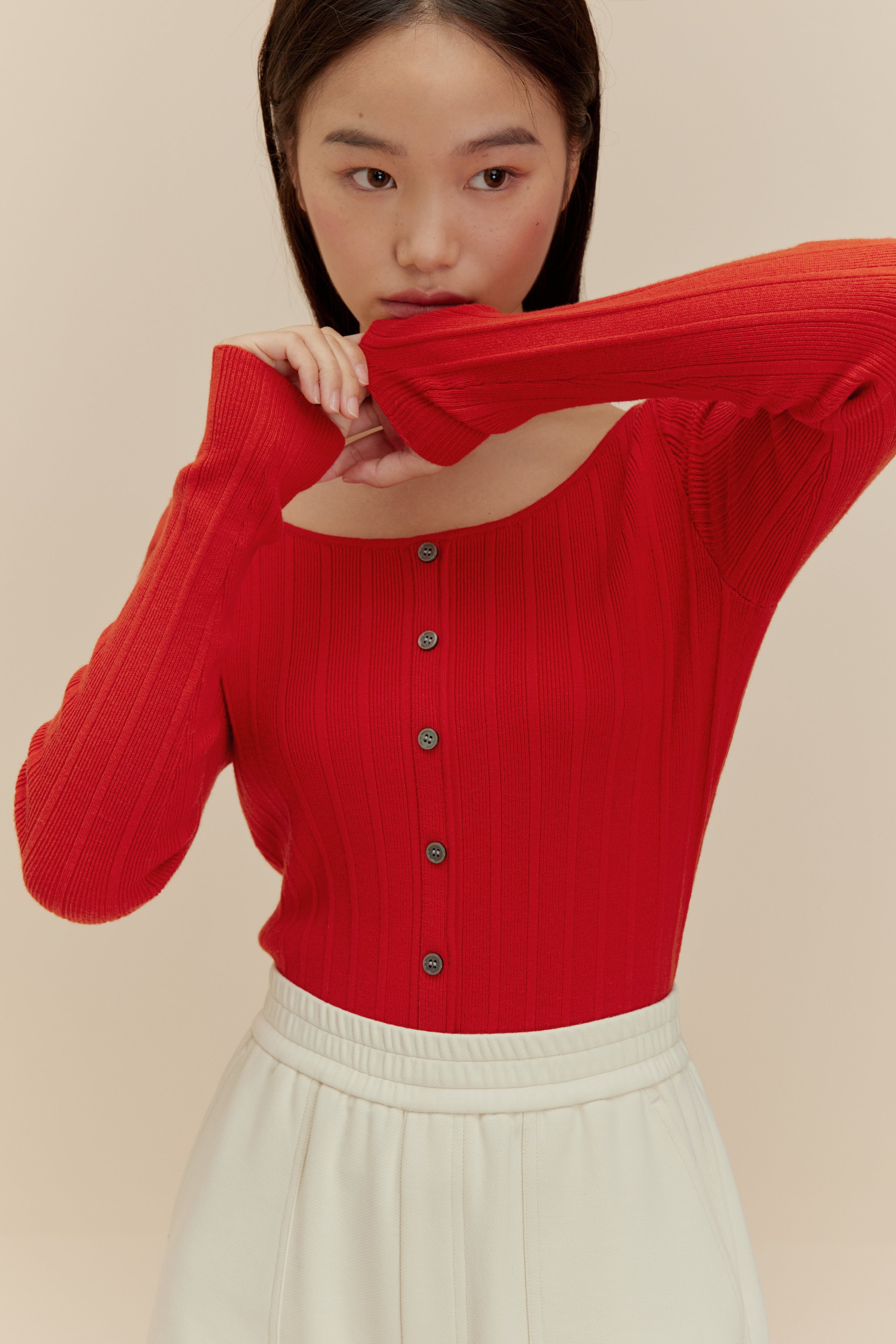 woman in red cardigan