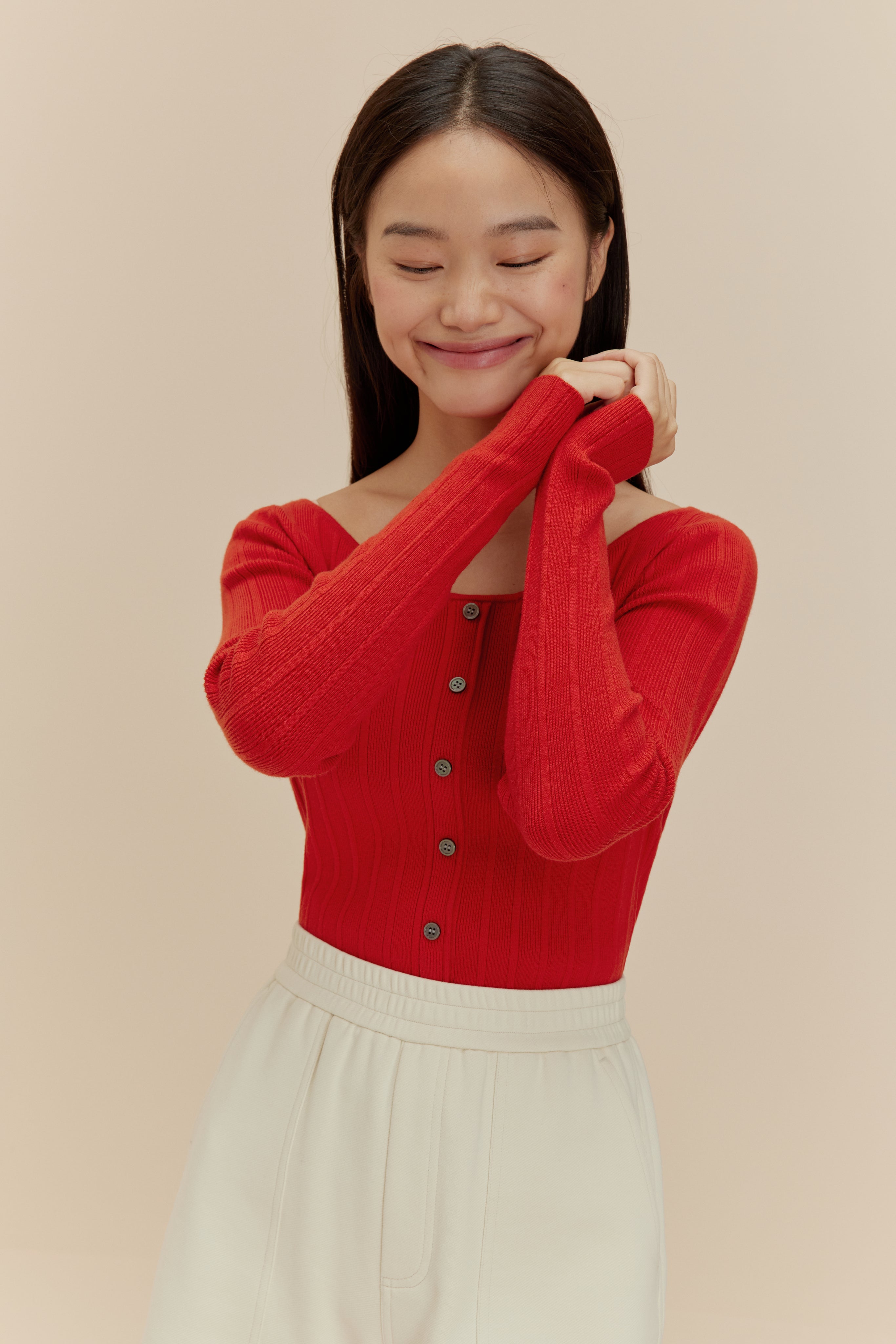 woman in red cardigan