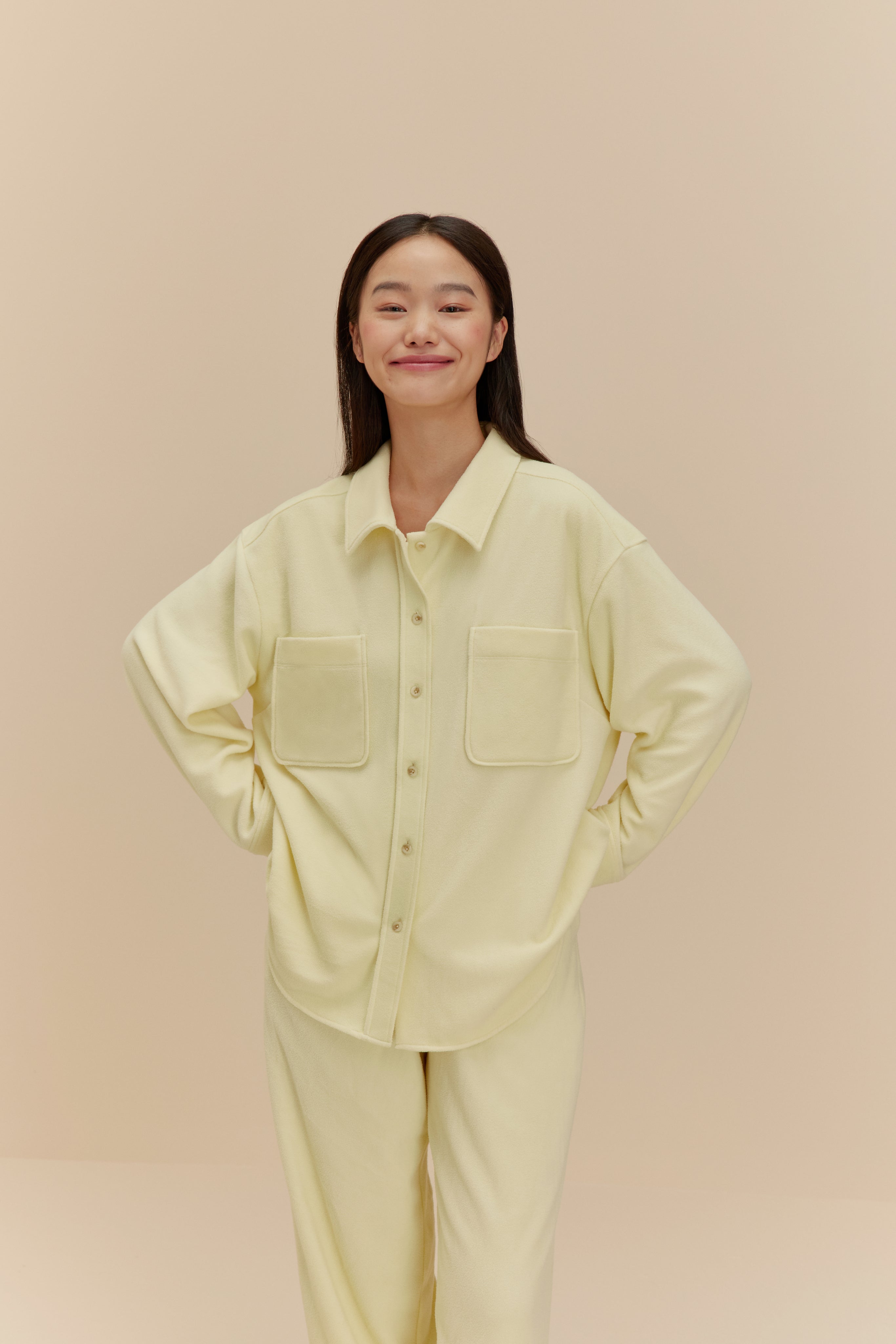 Woman wearing yellow Plushy Pajamas
