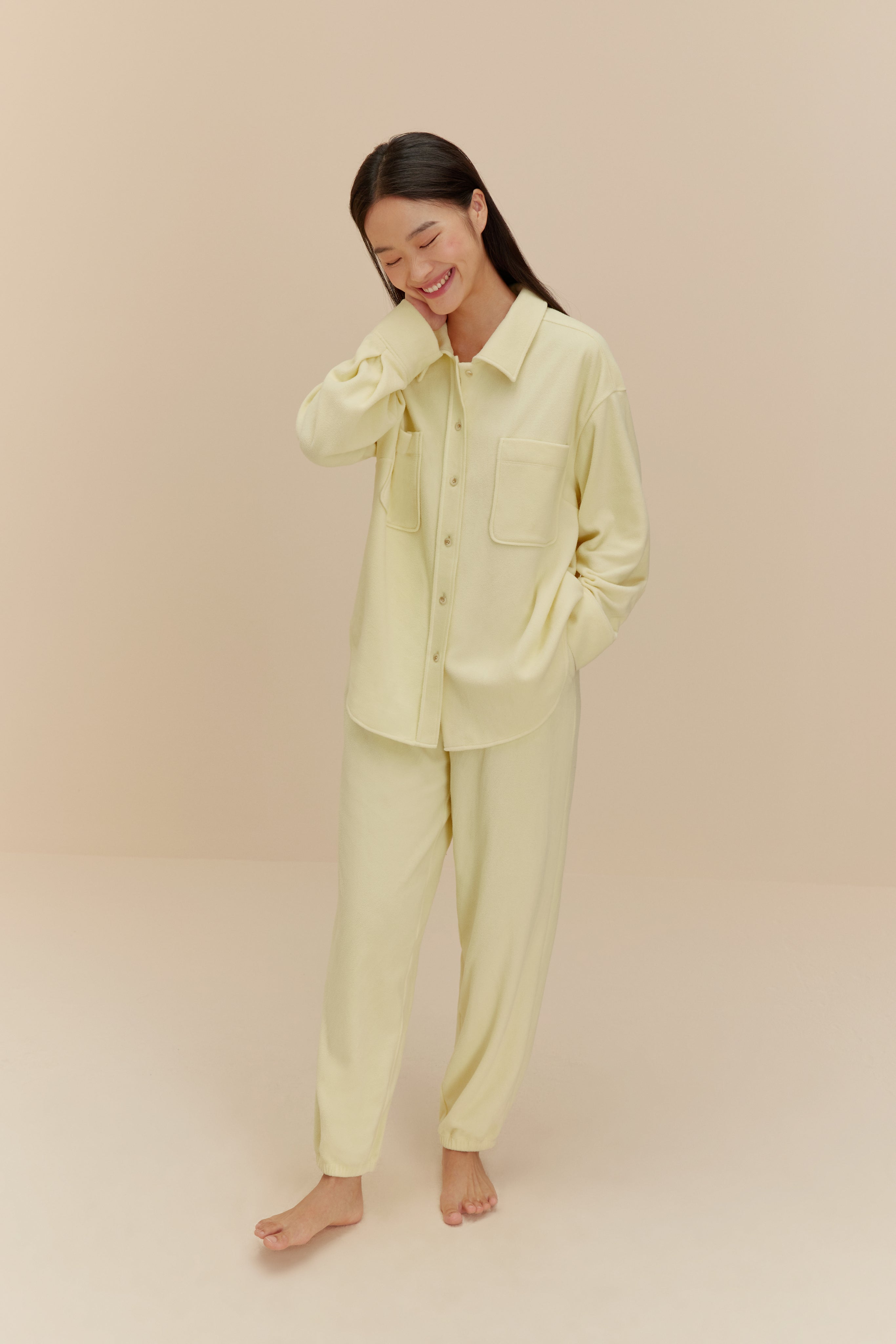 Woman wearing yellow Plushy Pajamas