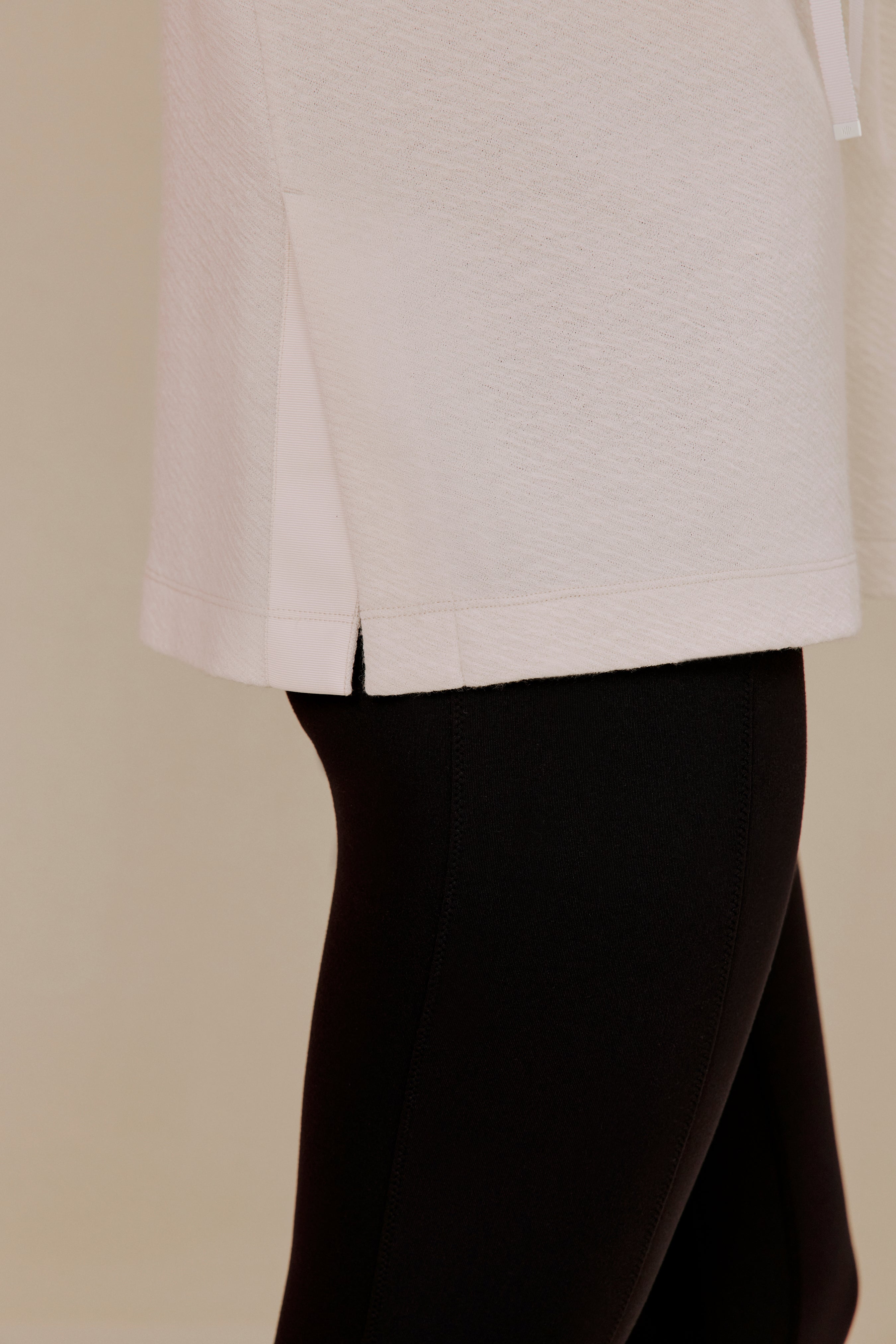 Close-up of white pullover