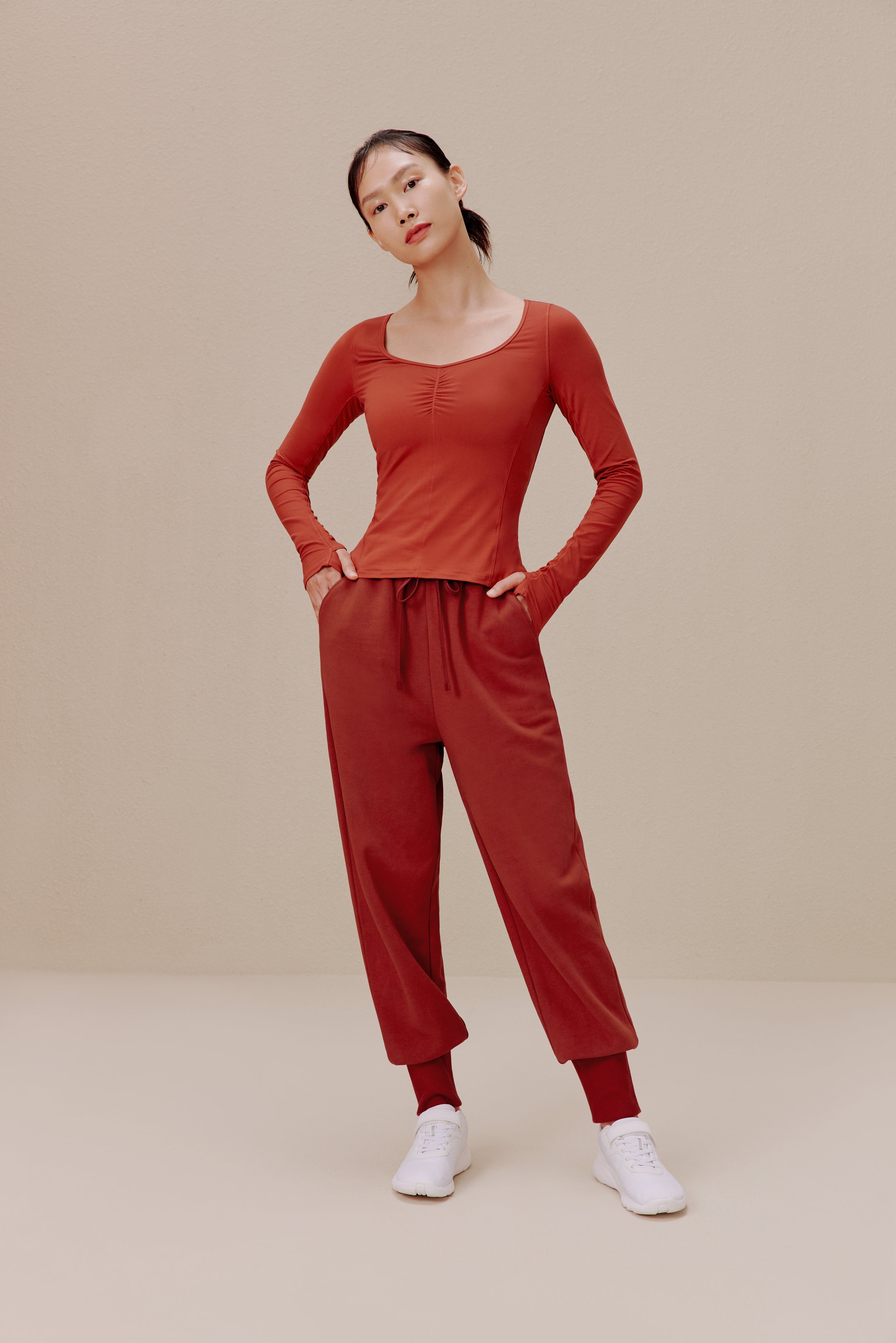 Woman in red top and sweatpants