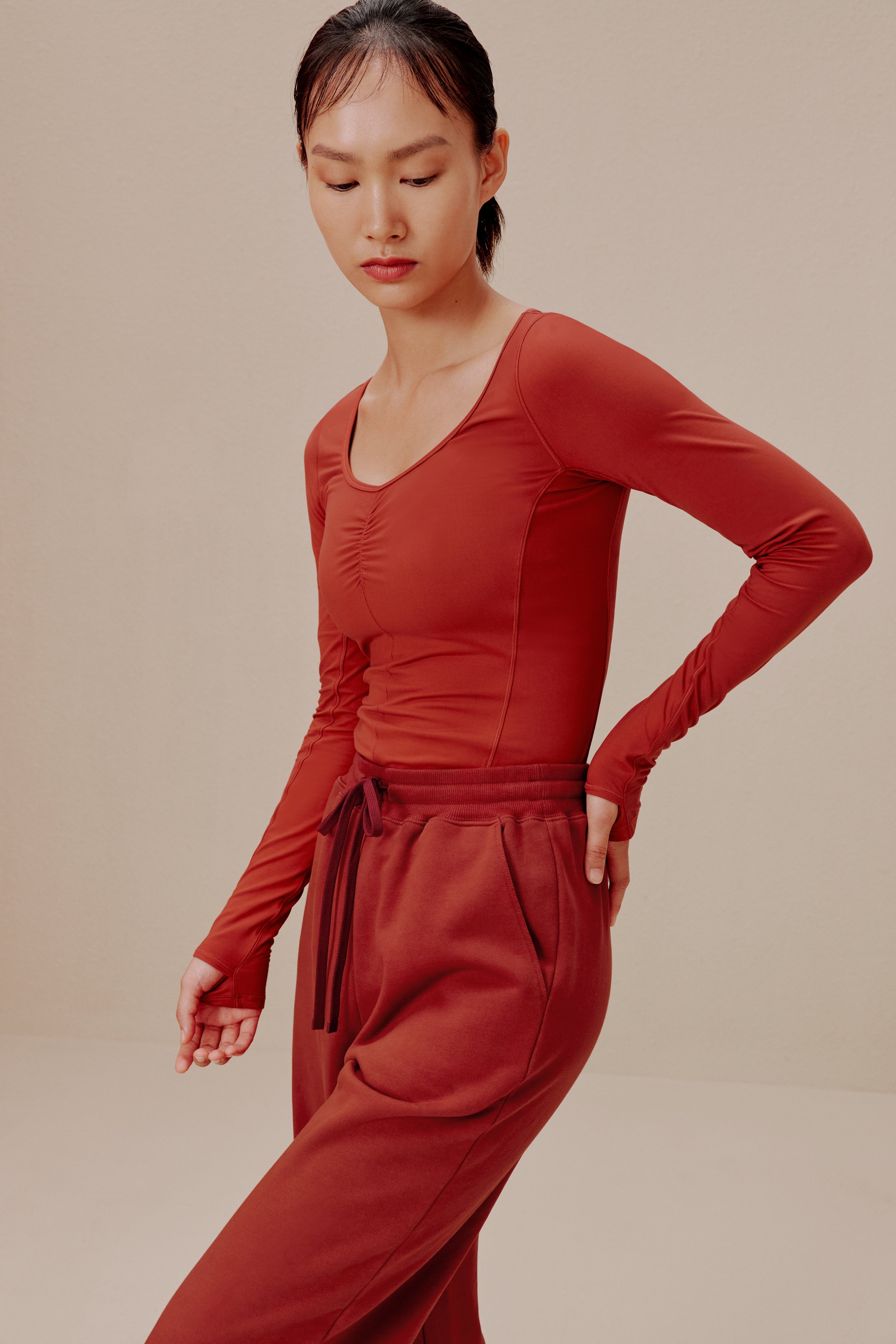 Woman in red top and sweatpants