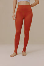Woman wearing orange leggings