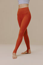 Woman wearing orange leggings
