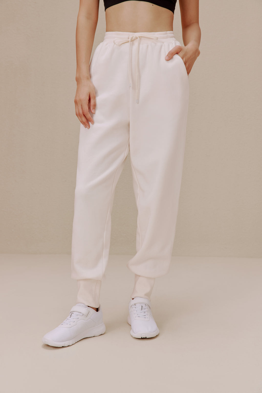 women in the white pants