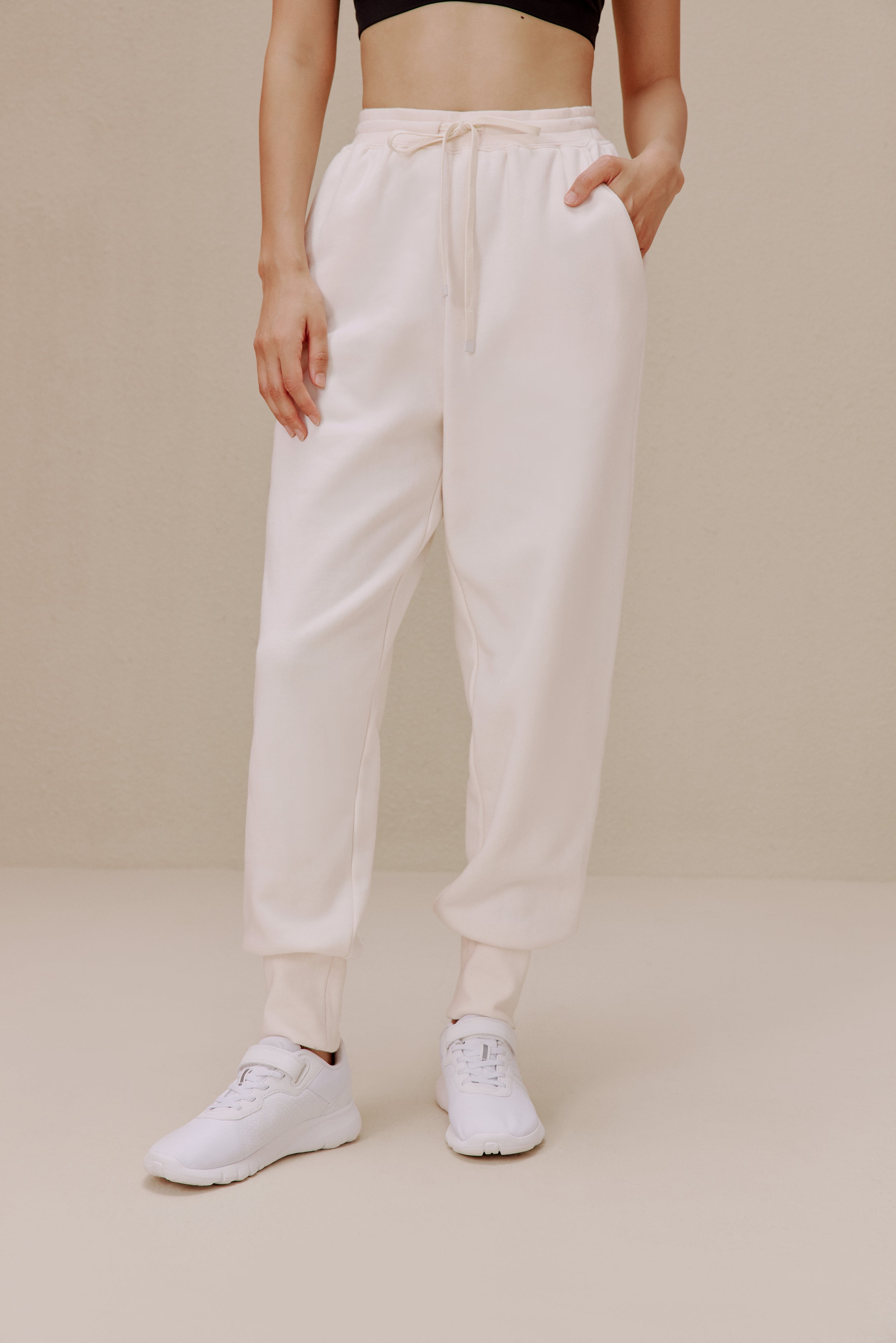women in the white pants