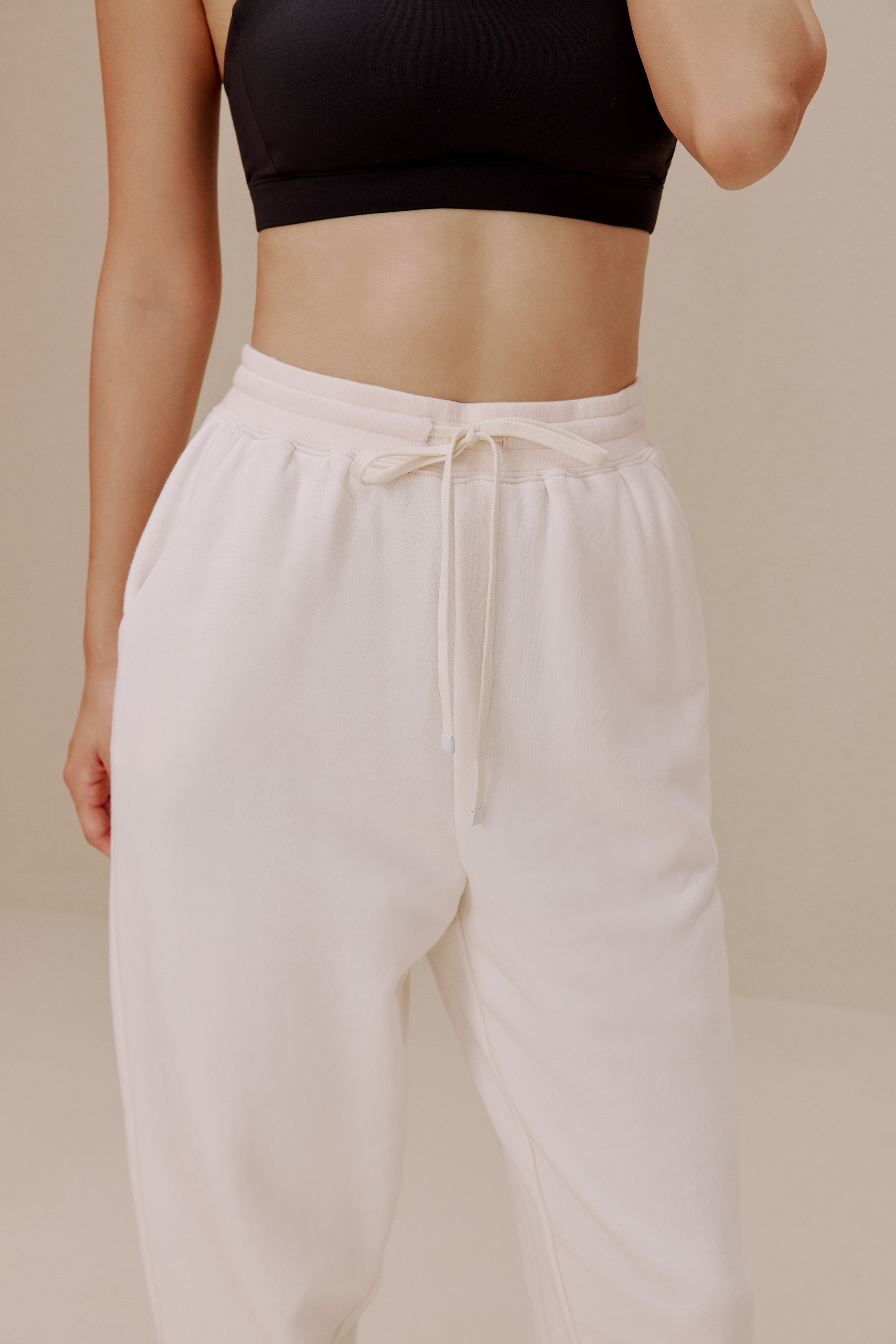women in the white pants