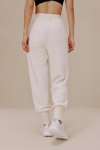 back of women in white pants