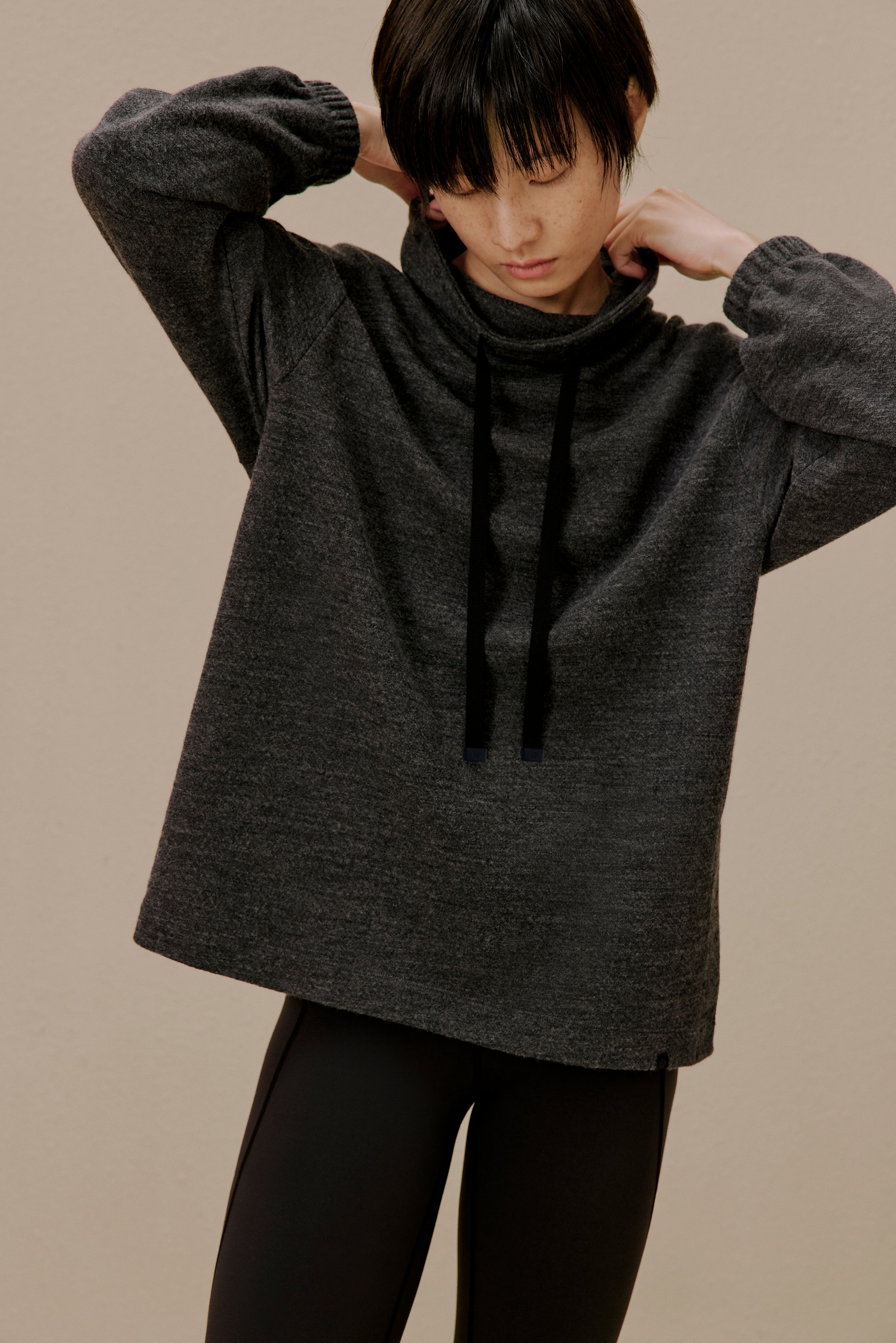 Woman in black pullover