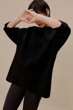 Woman in black top