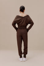 back of women in brown top and pants