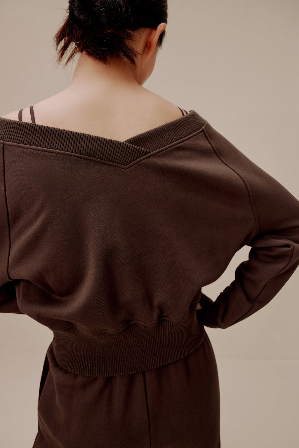back of women in brown top and pants