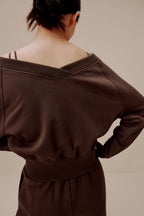back of women in brown top and pants
