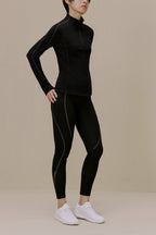 women in black active top and leggings