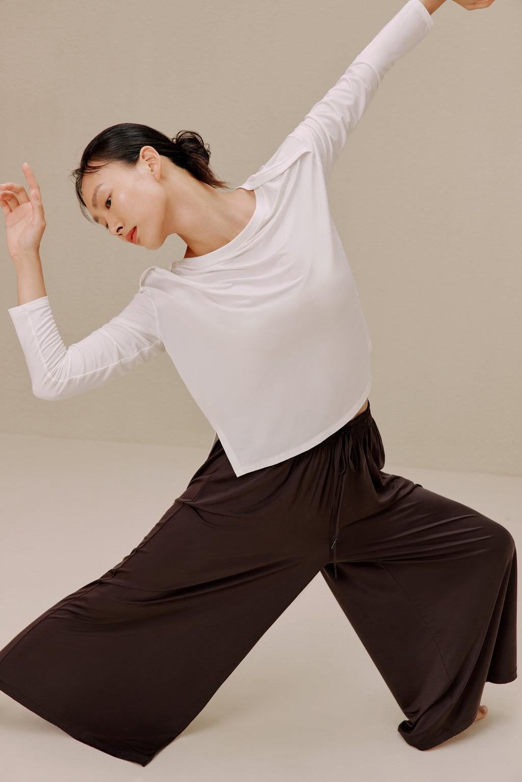 Woman in white top and pants