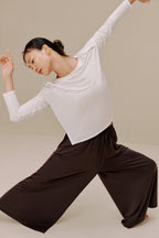 Woman in white top and pants
