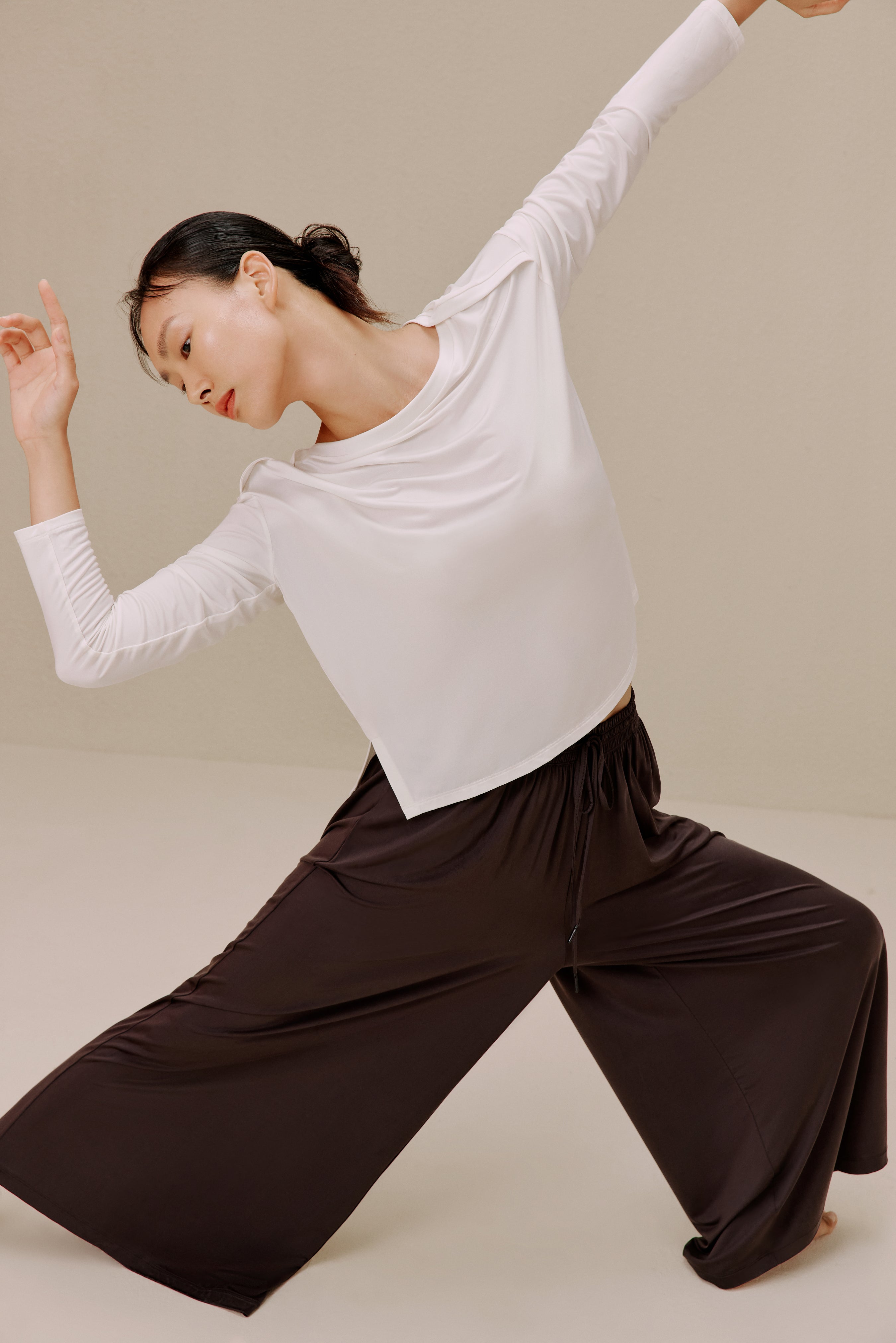 Woman in white top and pants