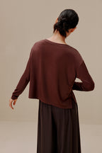 back of woman in brown top and pants