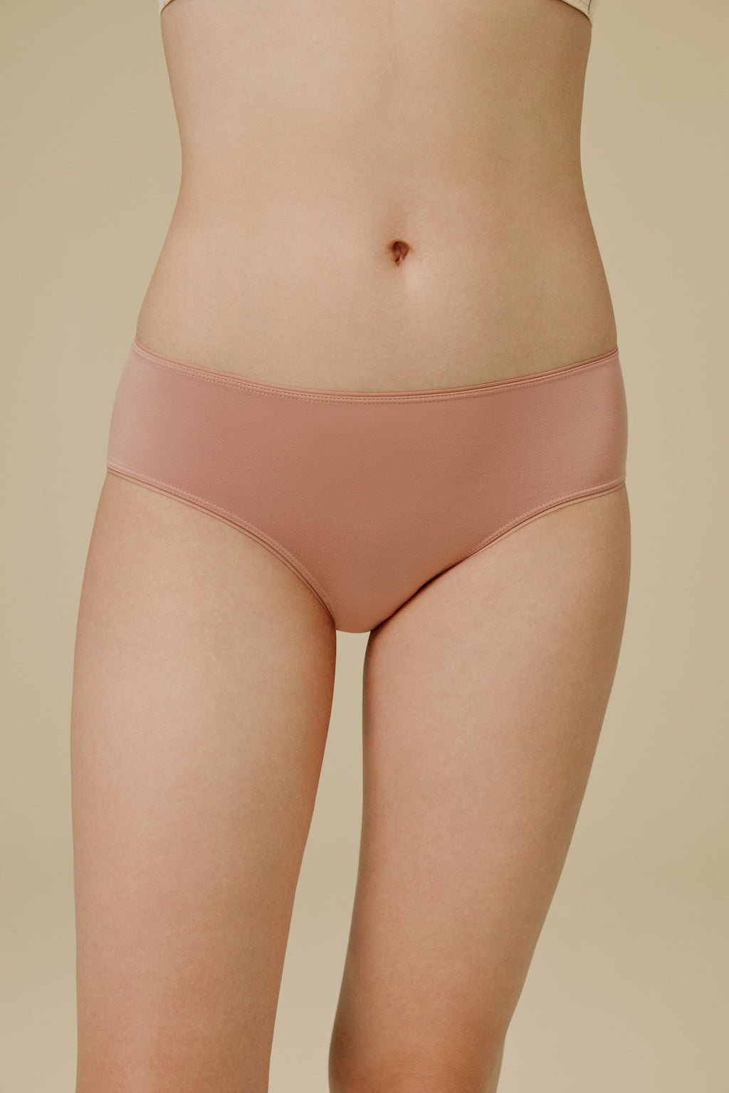 Woman in light pink panties