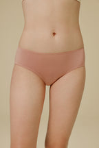Woman in light pink panties