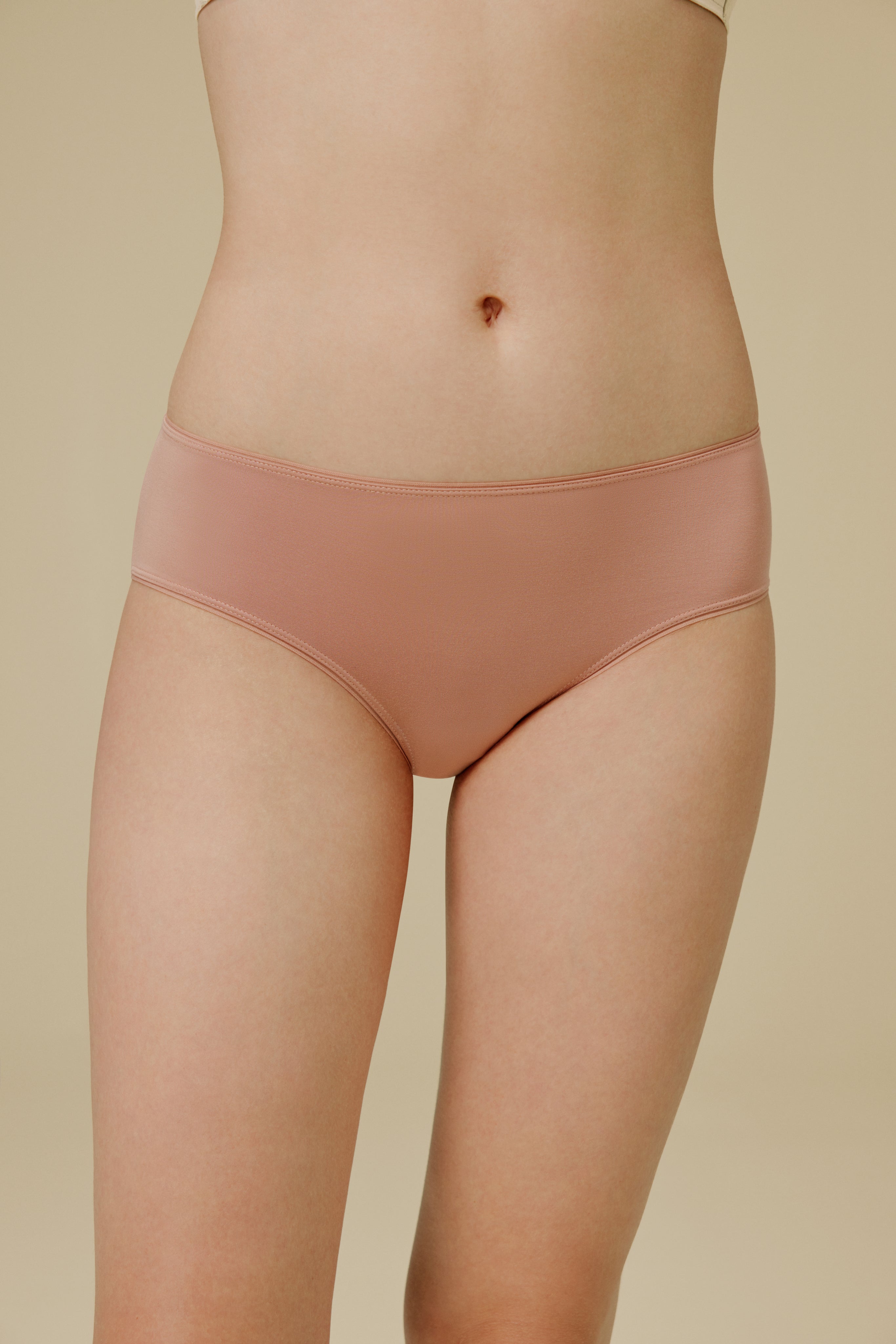Woman in light pink panties