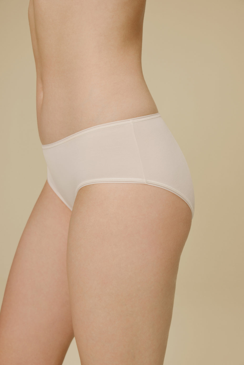 Side view of woman in white panties