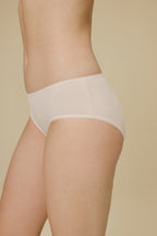 Side view of woman in white panties