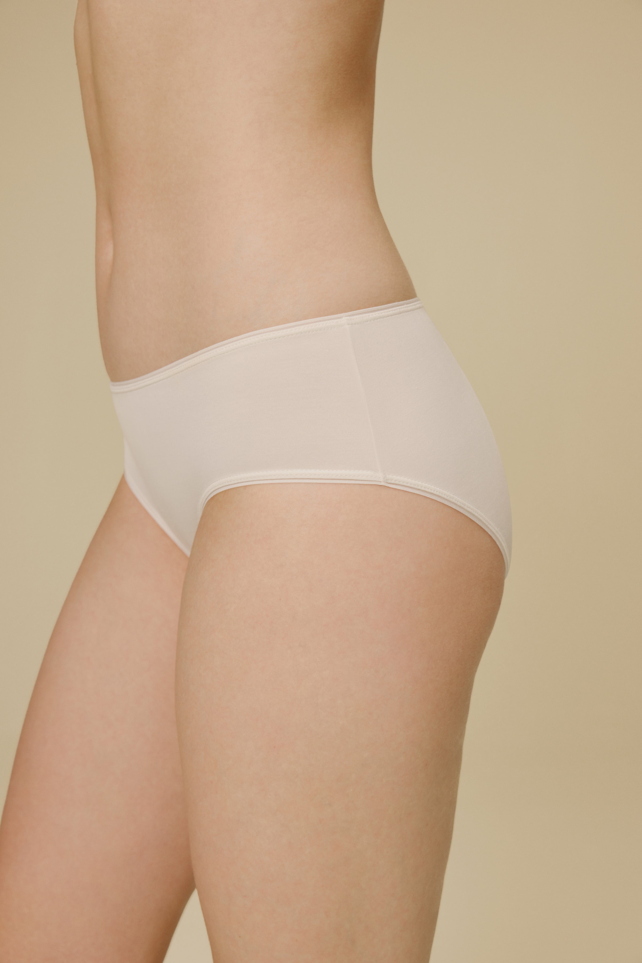 Side view of woman in white panties
