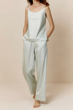 Woman in blue blush camisole and pants