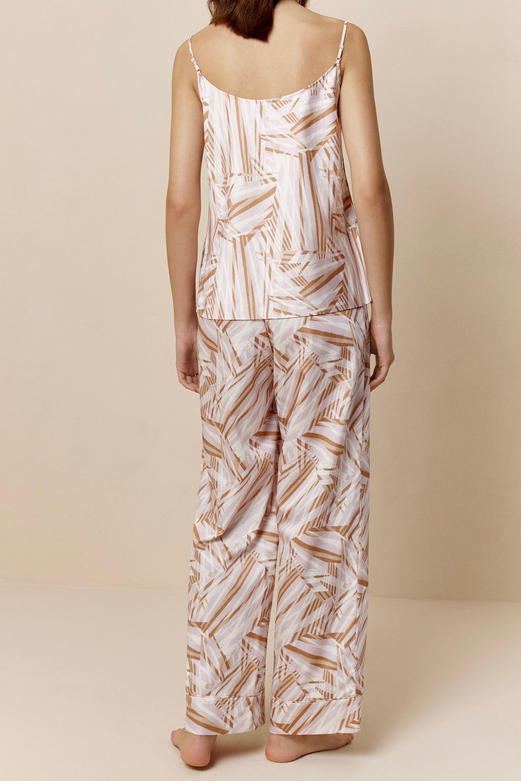 back of woman in abstract camisole and pants