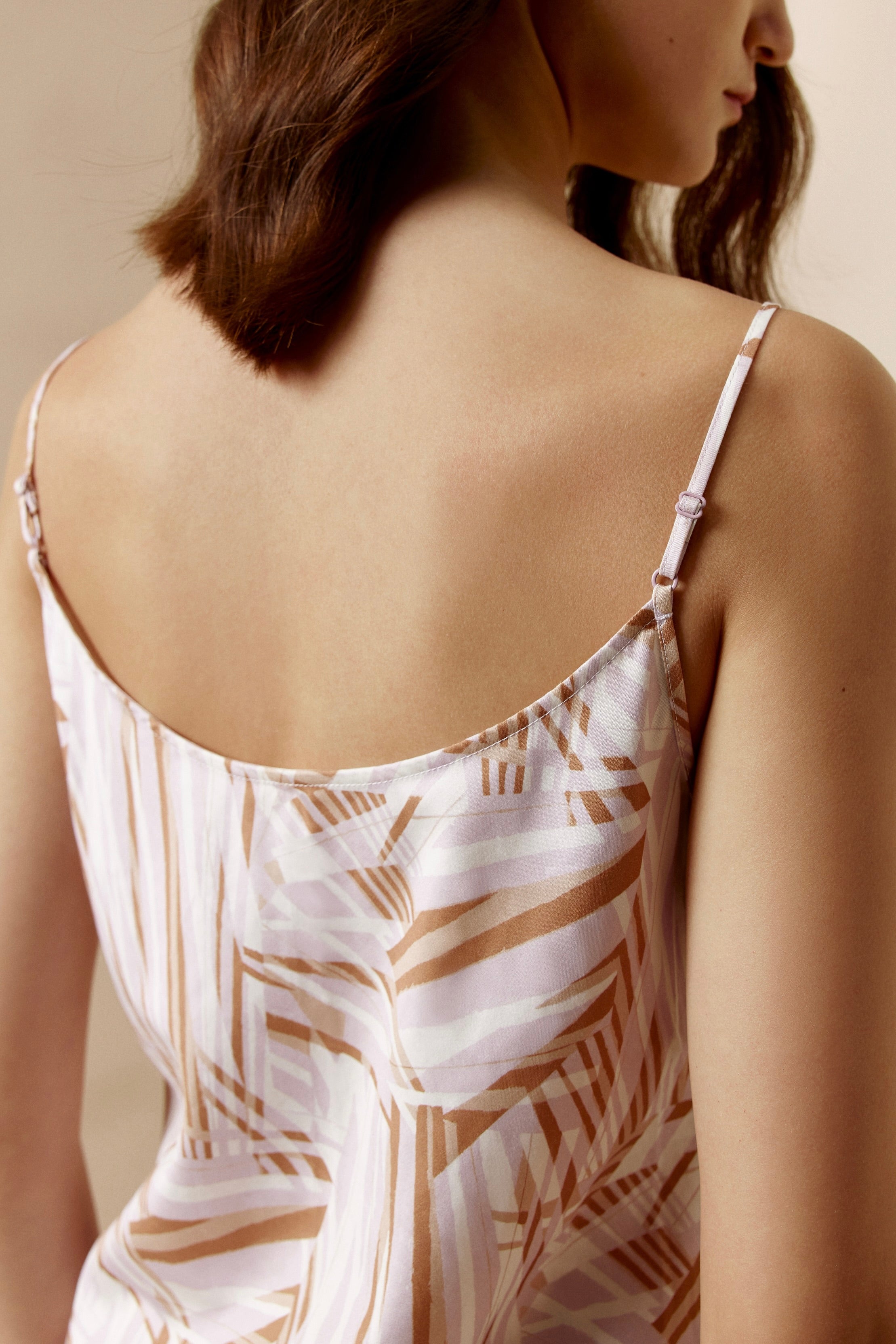 back of woman in abstract camisole