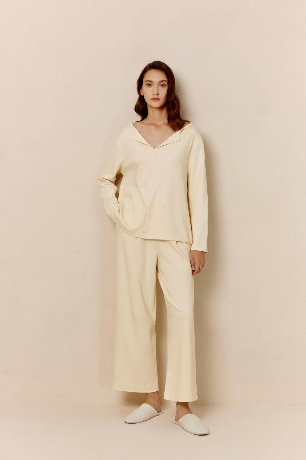 Woman in yellow top and pants.