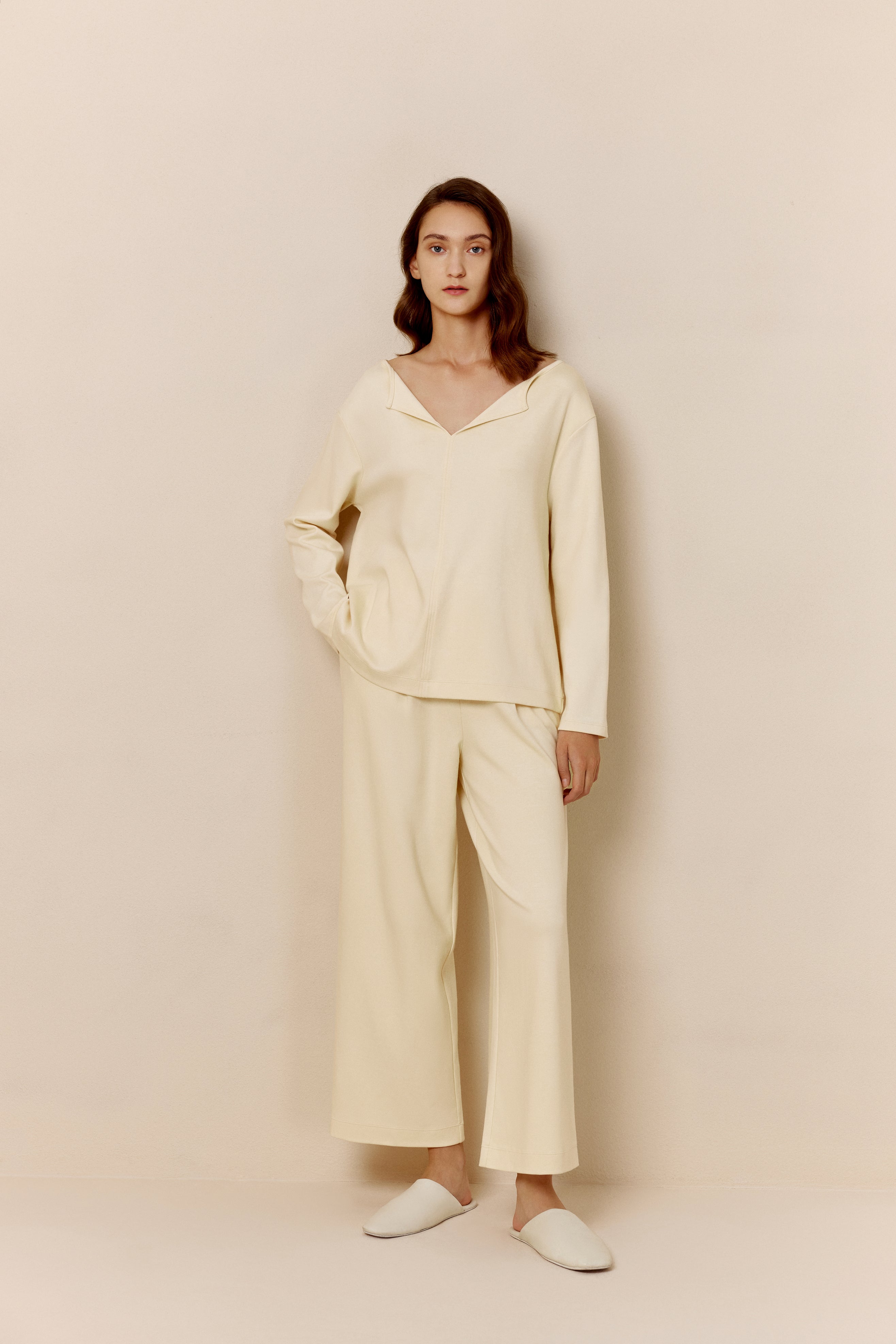 Woman in yellow top and pants.