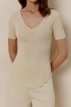 woman in off-white short-sleeved shirt